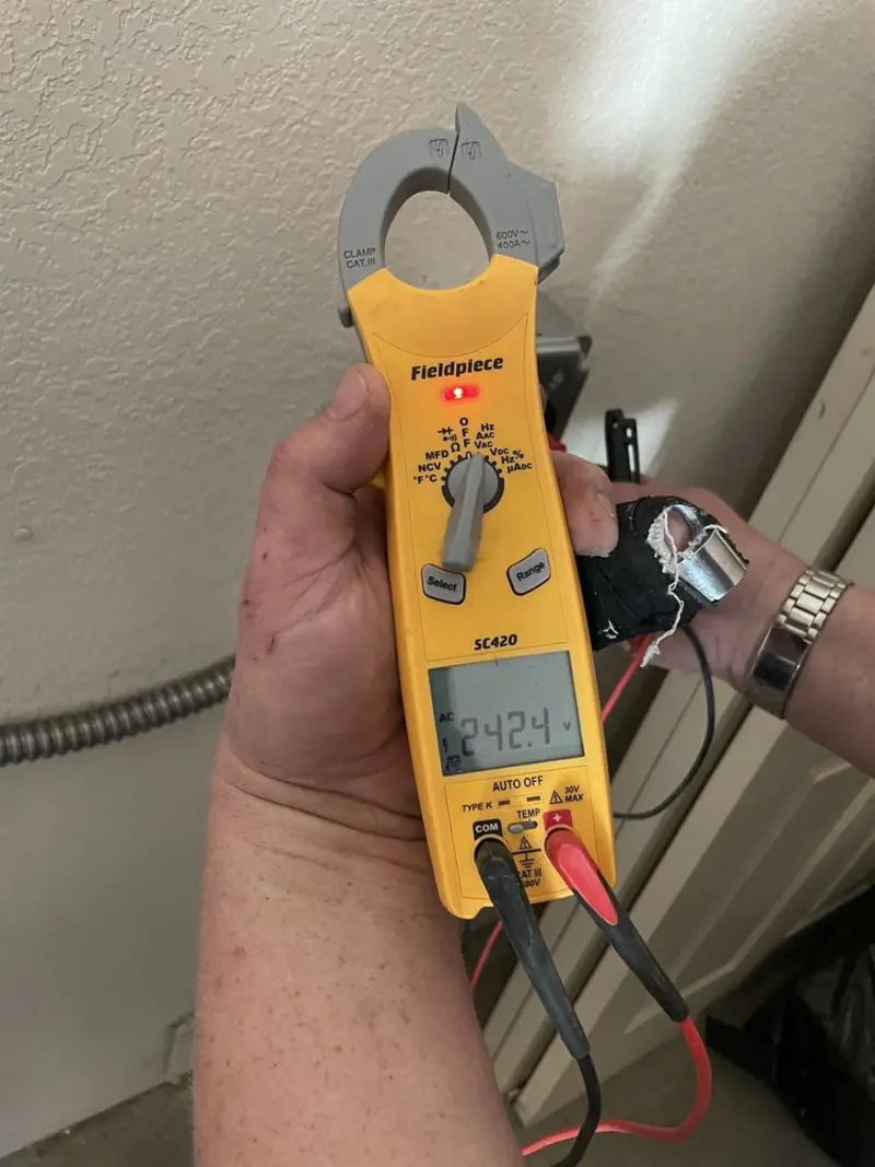 Voltage testing with clamp meter during Electrical Installation Services in Port St. Lucie